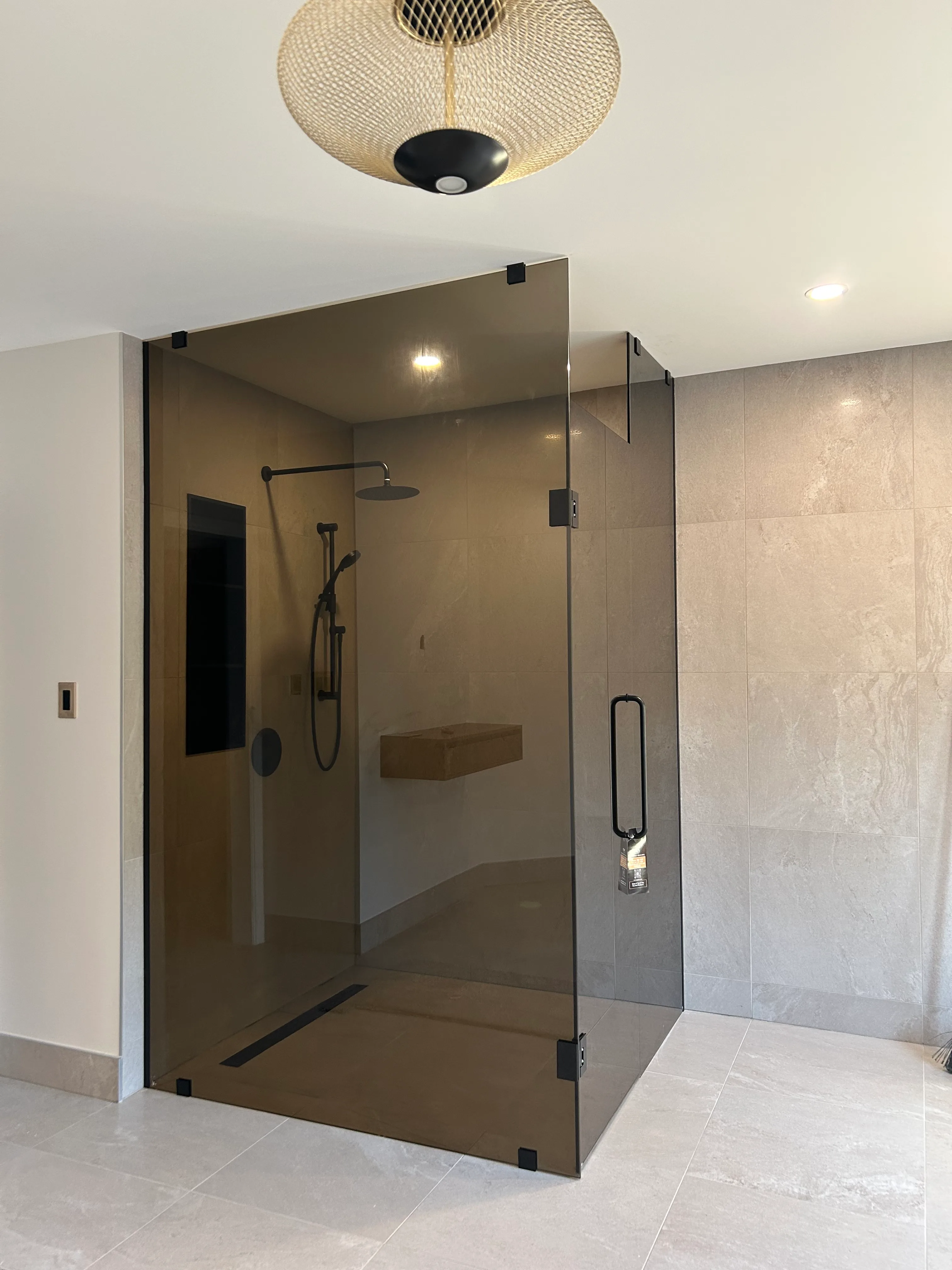 Frosted shower enclosure inside a luxury bathroom