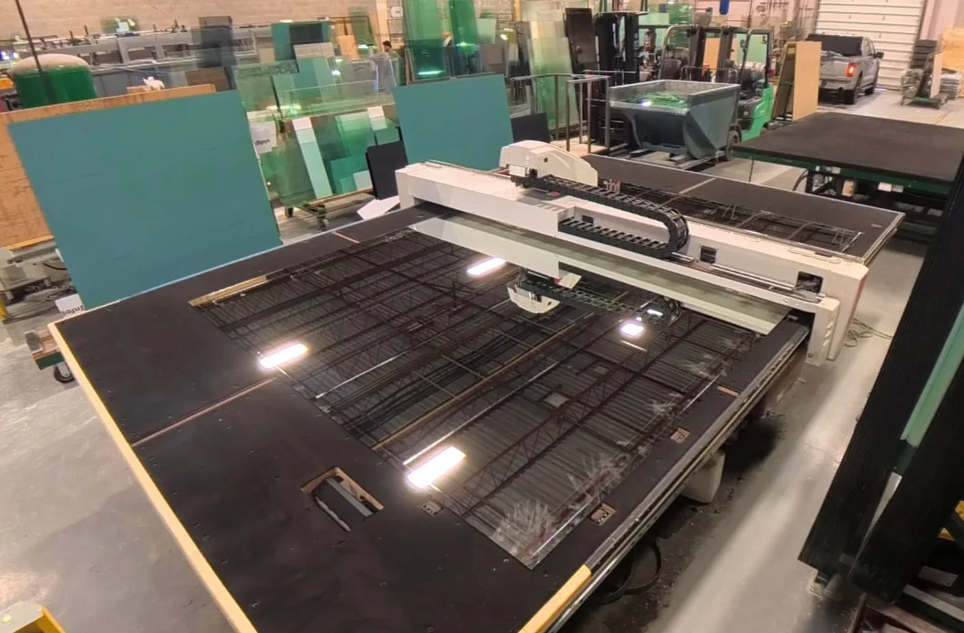 Vivid's CNC glass cutting table and fabrication equipment