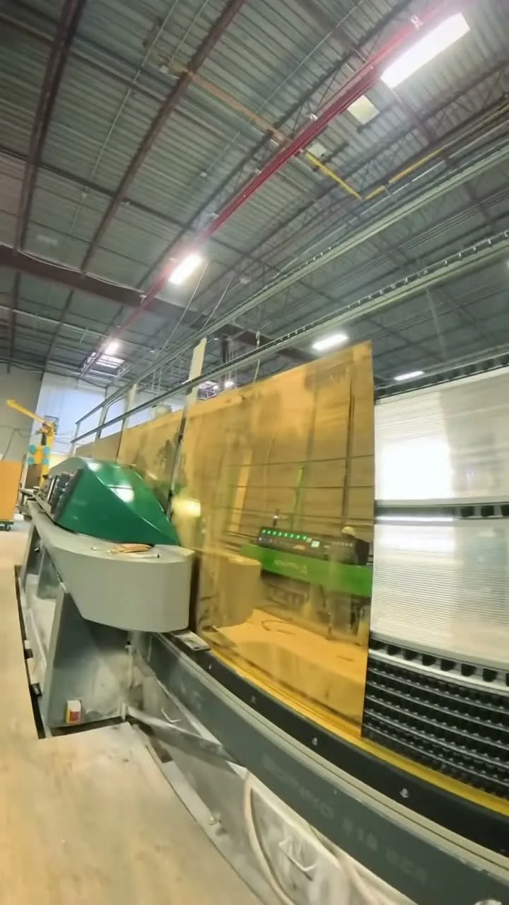 CNC machinery shaping glass at Vivid's Mississauga facility