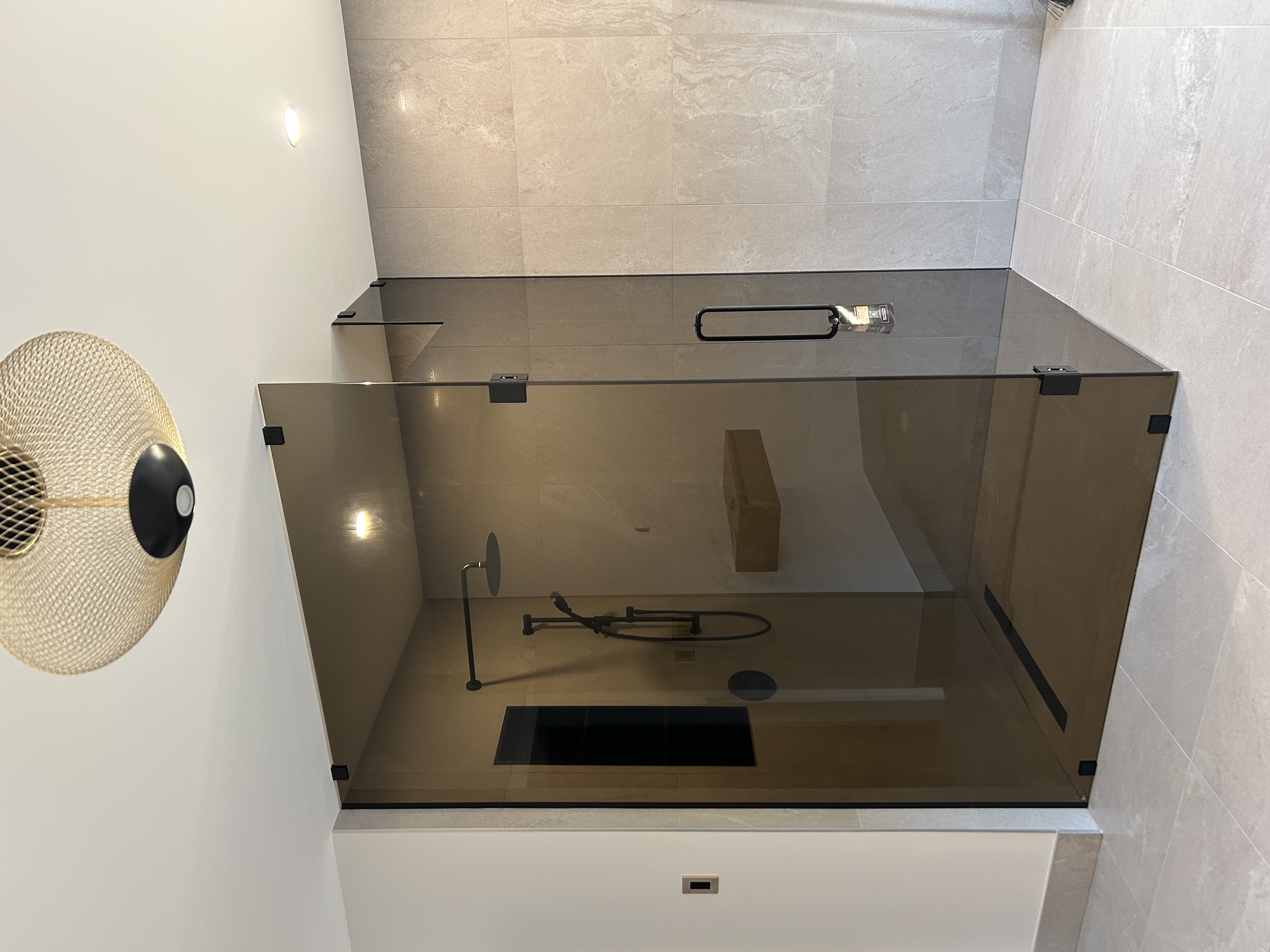 Frosted shower enclosure inside a luxury bathroom